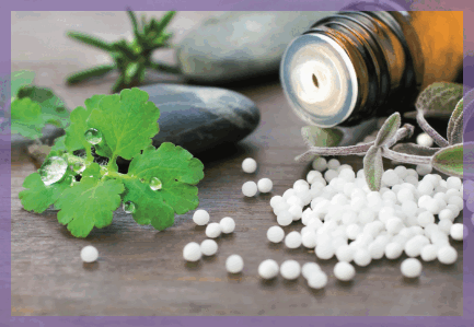 Homeopathic remedy pills, a glass bottle and medicinal plants
