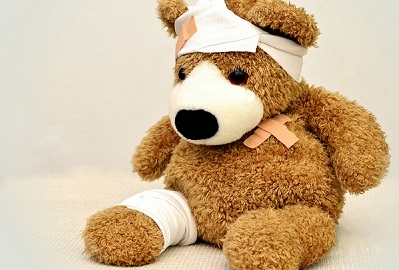 Teddy bear with bandages, a symbol of first aid
